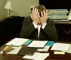 Frustrated person at a desk